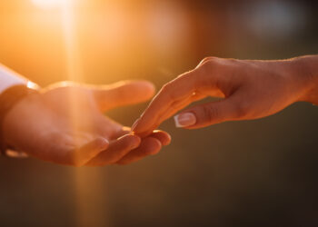 Newlyweds hands affectionate touch each other